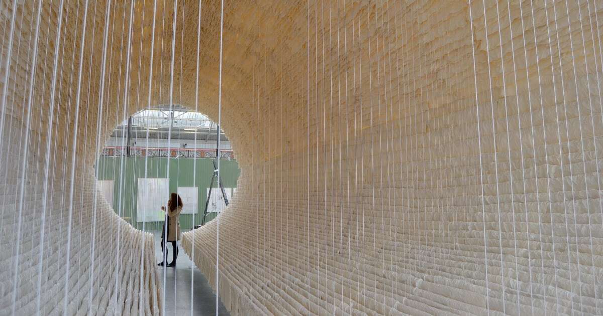 12,000 Sheets of Wrinkled Rice Paper Drape Around a Monumental Installation by Zhu Jinshi